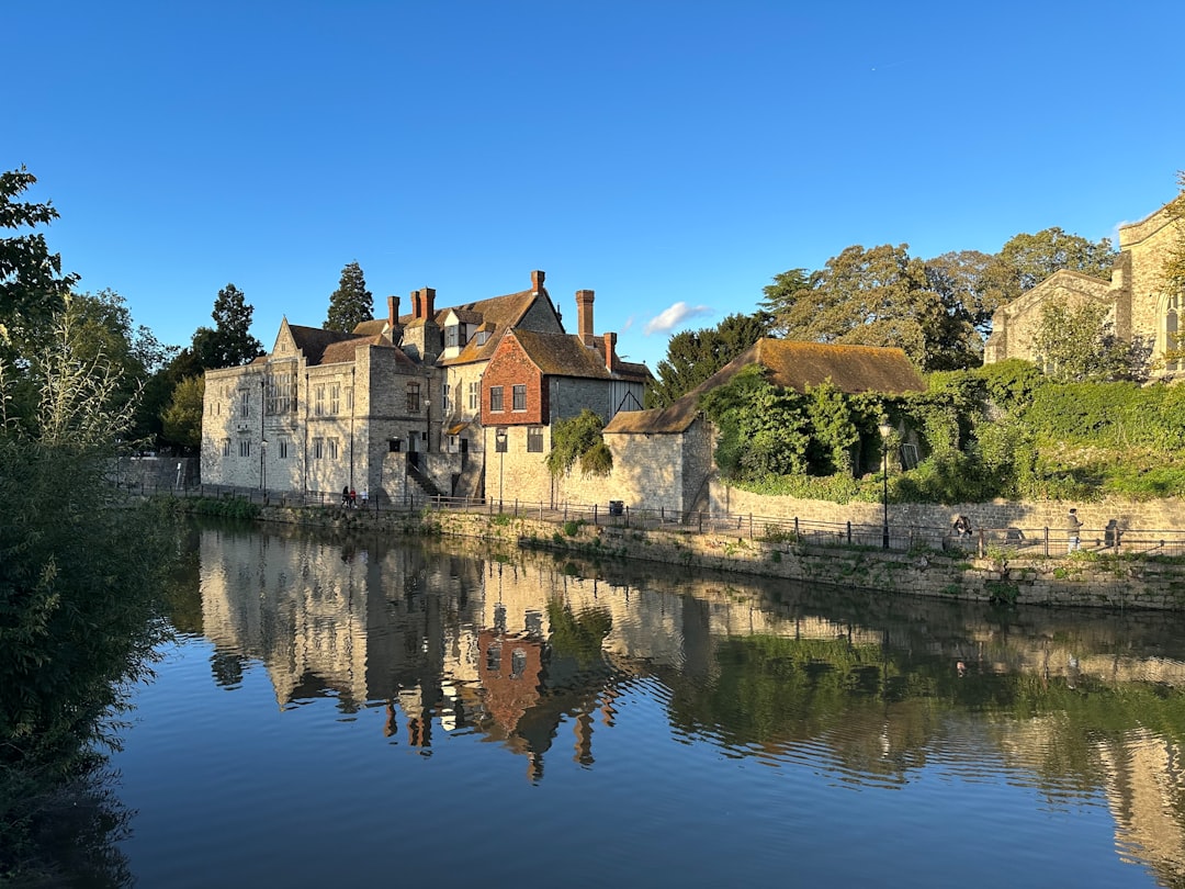 Maidstone, Kent: a large building next to a body of water